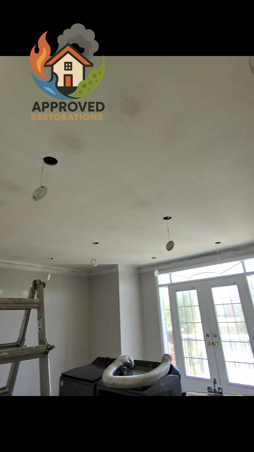 Tackling a major water damage insurance claim at this Vaughan home, our crew dropped the recessed lighting to seamlessly patch the compromised ceiling, routing heavy-duty dehumidifier lines over the laundry units to pull out the last of the structural moisture before we roll a fresh finish coat across the entire room.