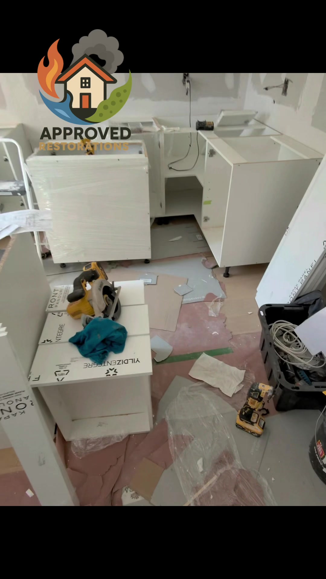 After a severe bathroom leak tore through this Vaughan home, our crew stripped out the water-damaged materials and is now deep into the reconstruction phase, staging tools and cutting fresh panels to install brand-new white cabinetry over protective floor paper to finally close out the insurance claim.