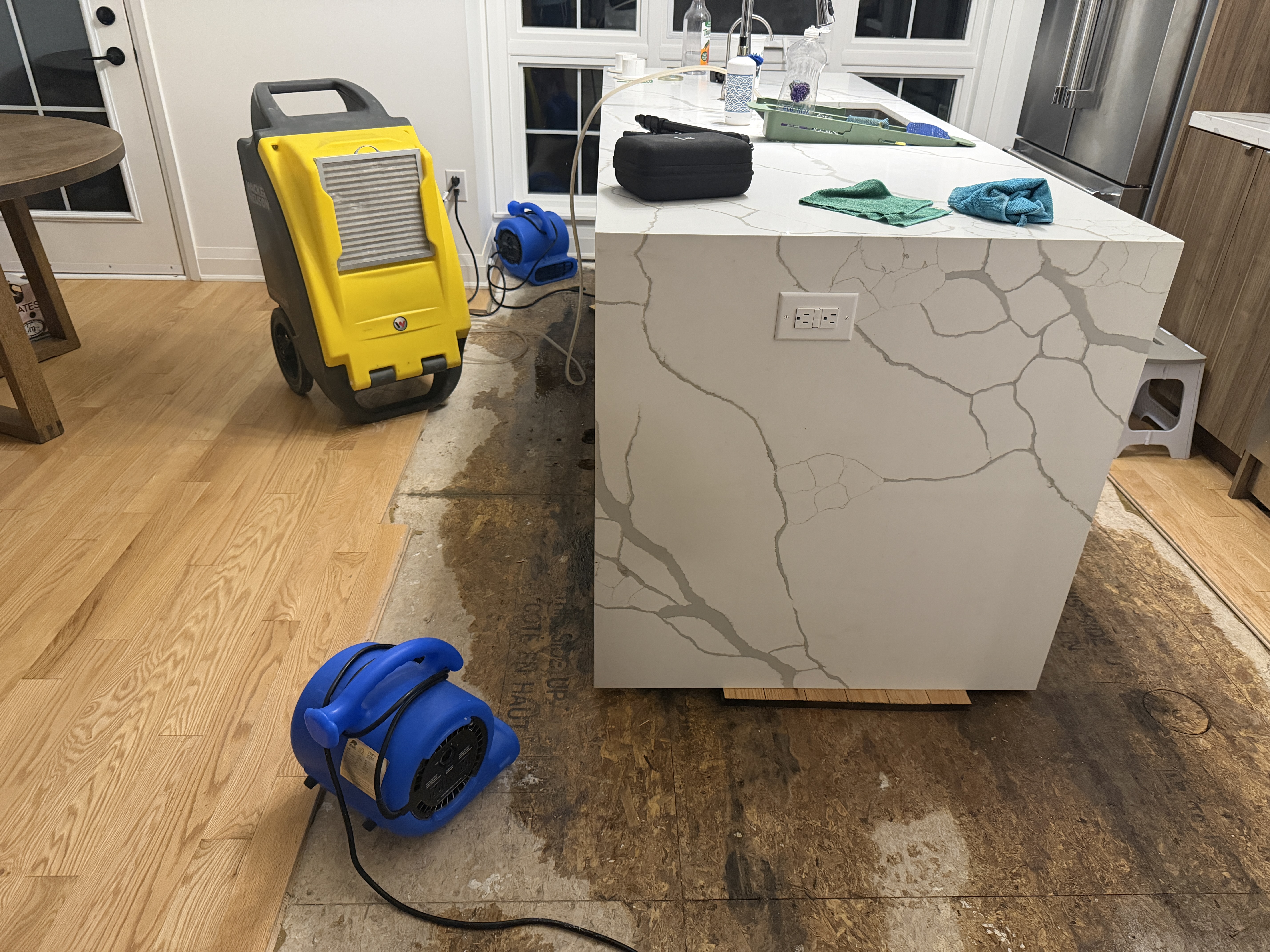 Kitchen flood damage before restoration